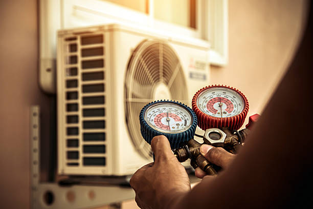 Professional Air Conditioning Service technician working in Walled Lake, MI